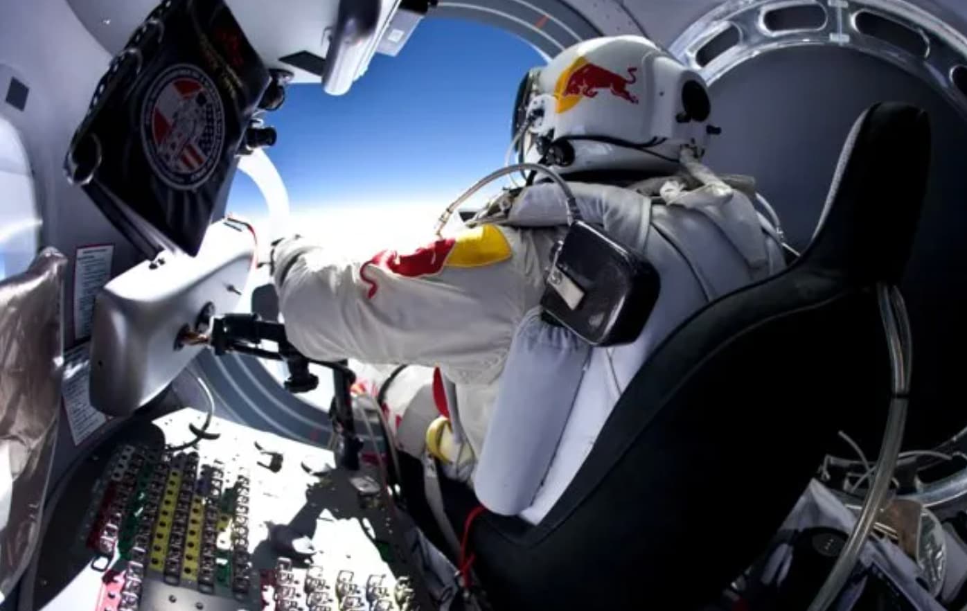 astronaut sitting on spaceship